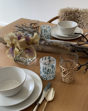 Load image into Gallery viewer, Styled on a driftwood summer table top, the white and turquoise speckled Murano tumblers are available to purchase online. Shop the range of hand sourced glassware by Rebecca Arts.
