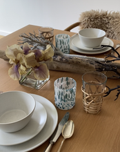 Load image into Gallery viewer, Styled on a driftwood summer table top, the white and turquoise speckled Murano tumblers are available to purchase online. Shop the range of hand sourced glassware by Rebecca Arts.