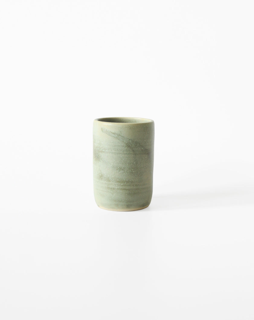 Green Ceramic Tumbler by Alice Passingham. Shop the range of hand sourced glassware and ceramics by Rebecca Arts online.