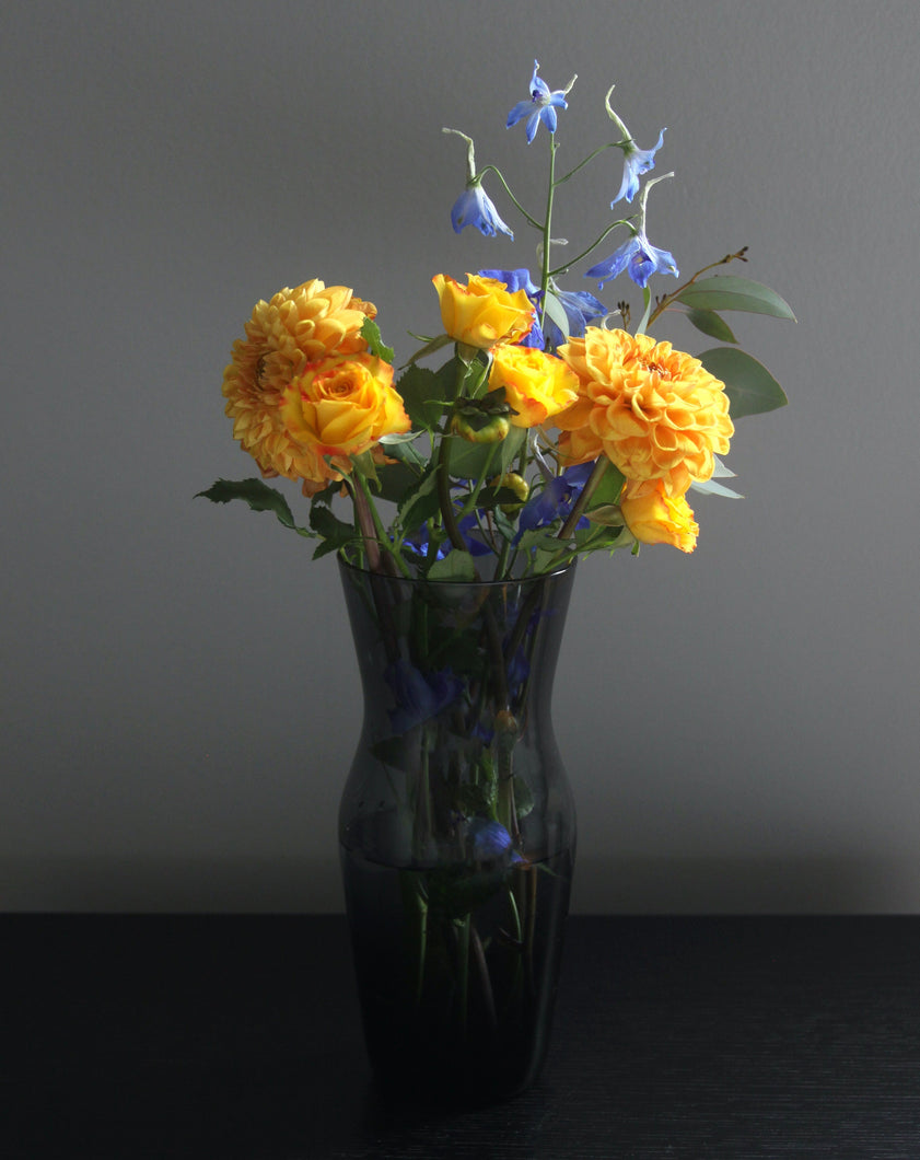 Mid Century Smoked Glass Vase. Shop the range of hand sourced ceramics and glassware by Rebecca Arts online.