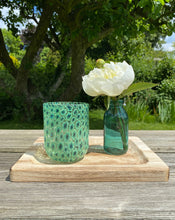 Load image into Gallery viewer, Murano tumbler in light green featuring a petite Murrine floral pattern. Shop the range of Murano tumblers hand sourced by Rebecca Arts online.

