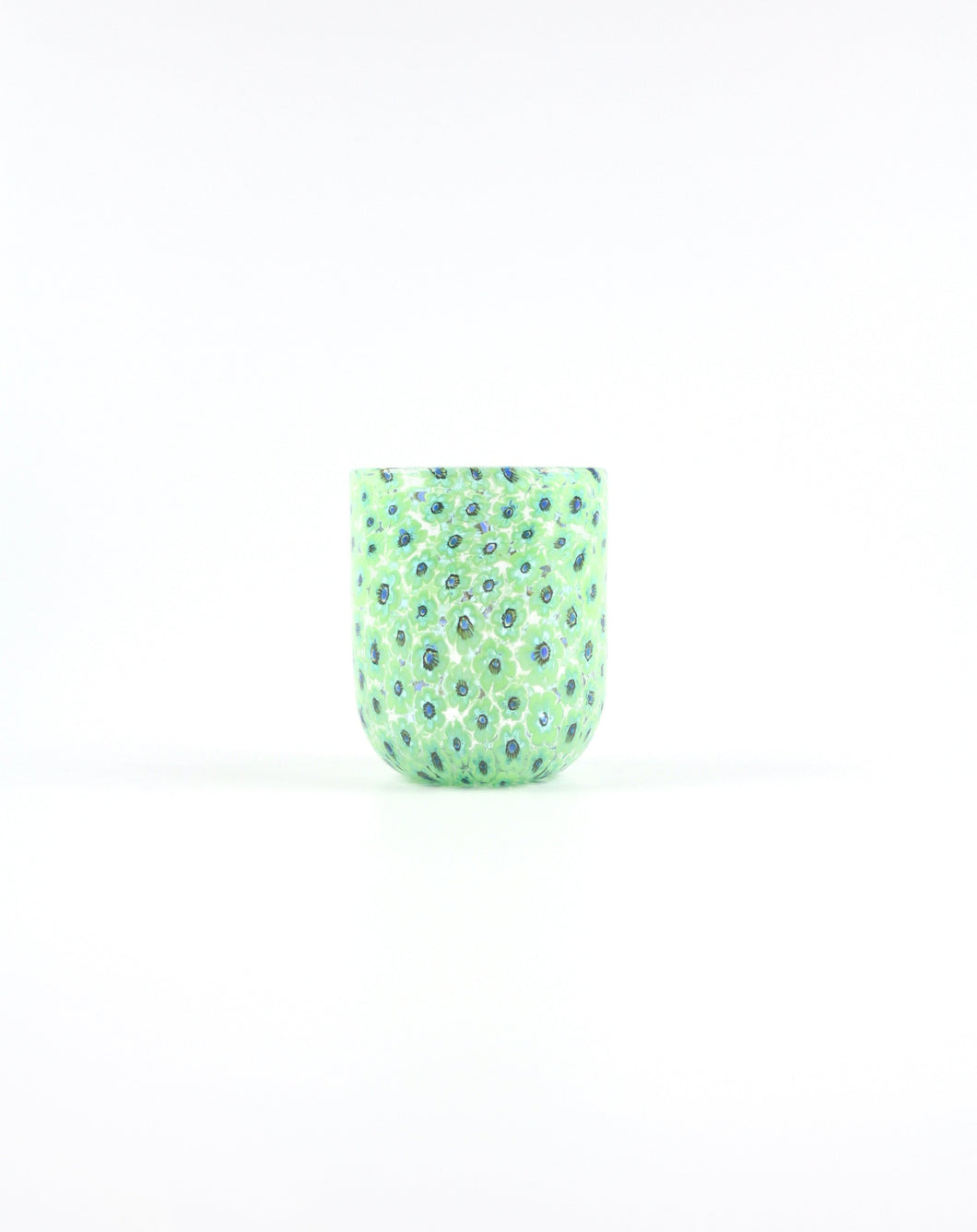 Murano tumbler in light green featuring a petite Murrine floral pattern. Shop the range of Murano tumblers hand sourced by Rebecca Arts online.