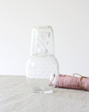 Load image into Gallery viewer, Carafe and tumbler glass dating from the Edwardian era and featuring a star cut pattern. Shop the range of hand sourced glassware and ceramics by Rebecca Arts online.
