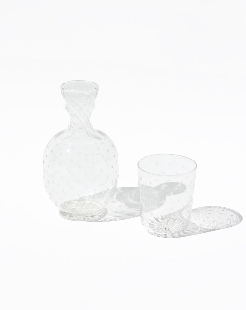 Carafe and tumbler glass dating from the Edwardian era and featuring a star cut pattern. Shop the range of hand sourced glassware and ceramics by Rebecca Arts online.